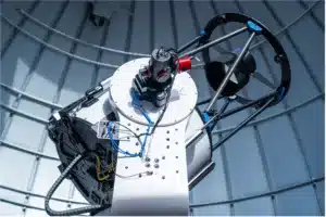 he instrumentation port side of a Planewave CDK700 telescope at Bruneau Dunes State Park, allowing multiple cameras or instruments to be attached to a field-derotator and independent electronic focuser on an Optec Perseus instrument selector. The periscope for visitor accessibility remains attached to the opposite side of the telescope.